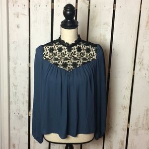 Charlotte Russe long sleeve lace neck top.